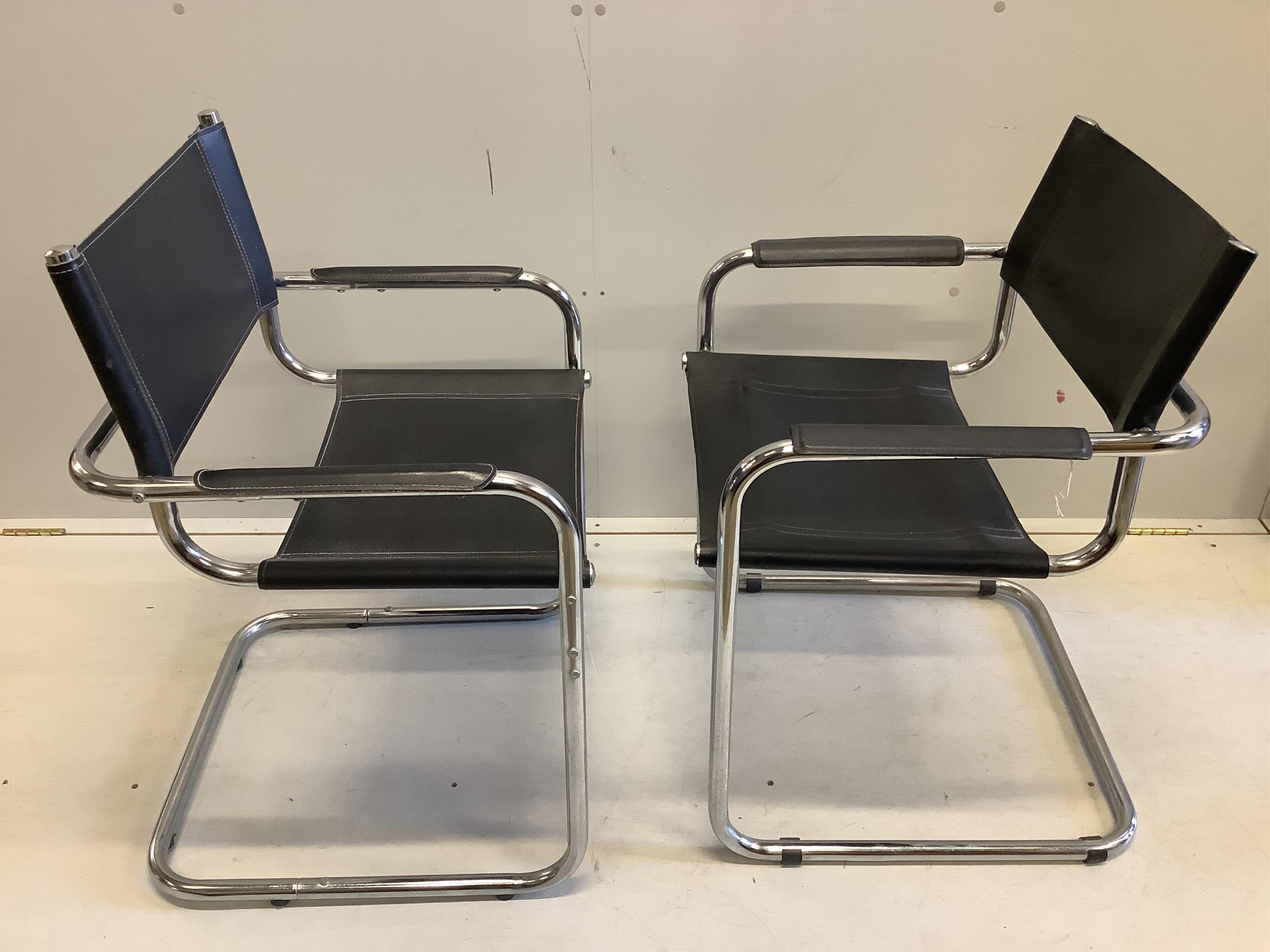 A near pair of chrome and black leather cantilever chairs, width 61cm, depth 60cm, height 80cm. Condition - fair